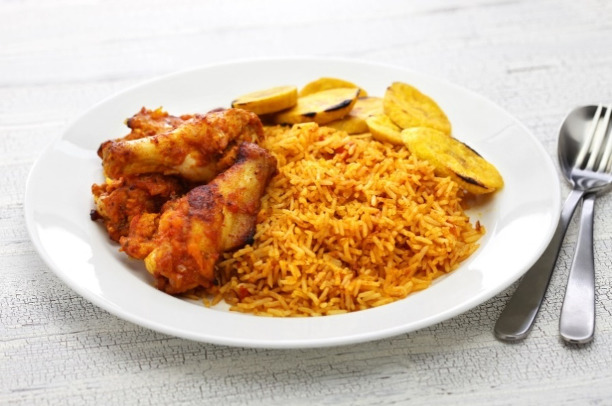 Jollof Peacock rice with chicken and fried plantain